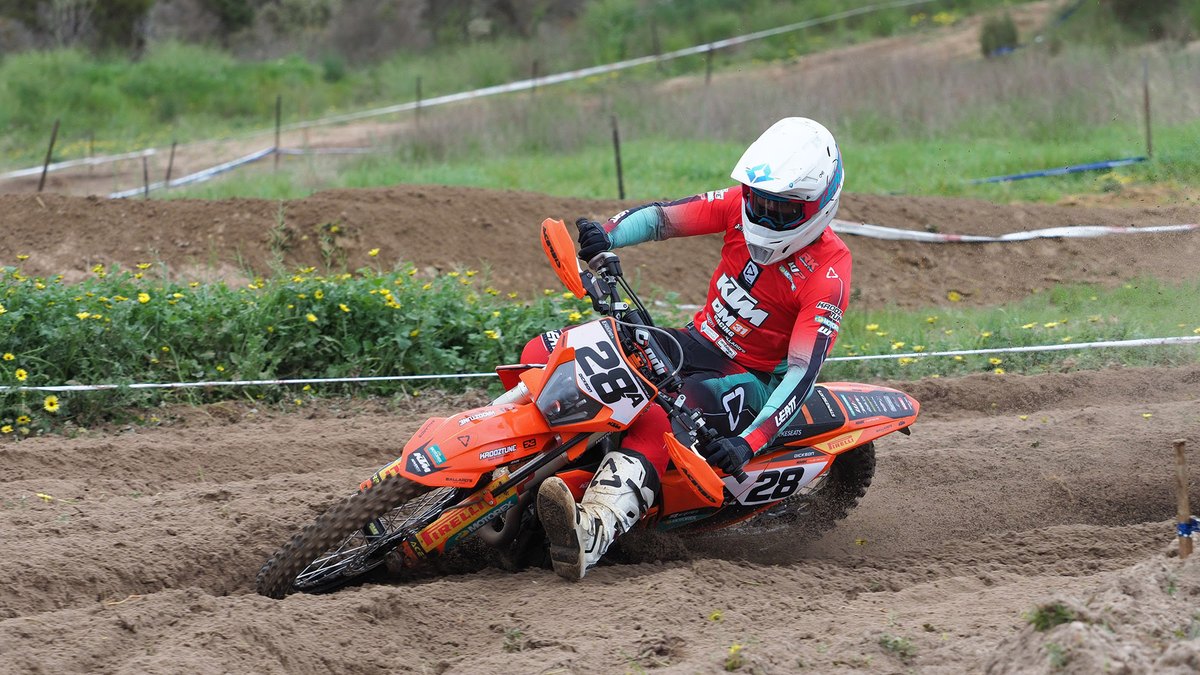 An enduro rider on an orange KTM races through deep sand at the AusEnduro finale in Coonalpyn, South Australia