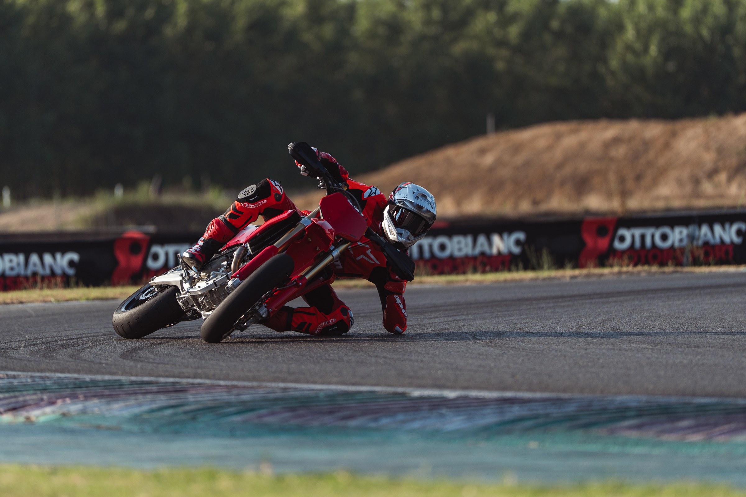 Desmo450 SM knee-down lean on paved supermoto circuit