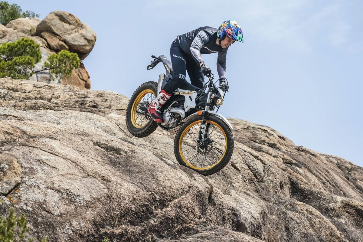 Rider descending steep rock face on Montesa 4Ride trail-trial motorcycle