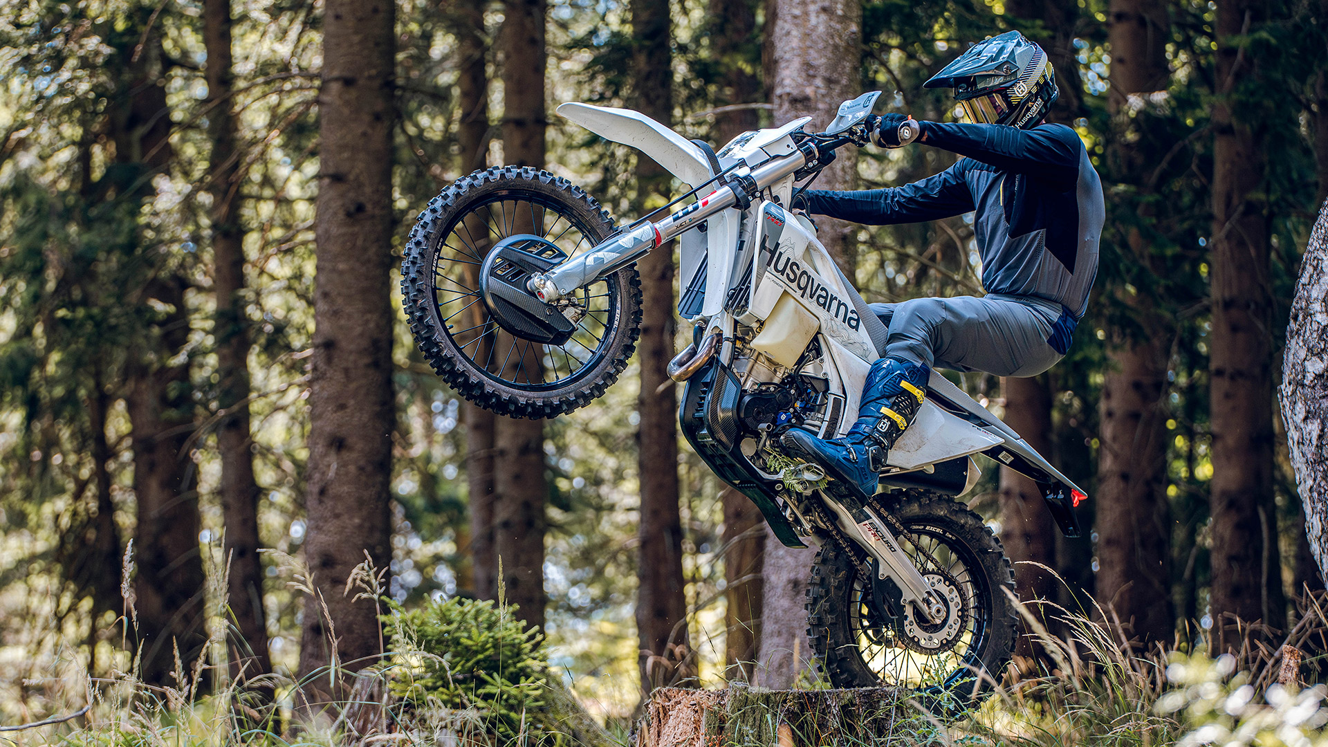 Husqvarna MY27 Pro enduro — forest wheelie action still from Pro press pack