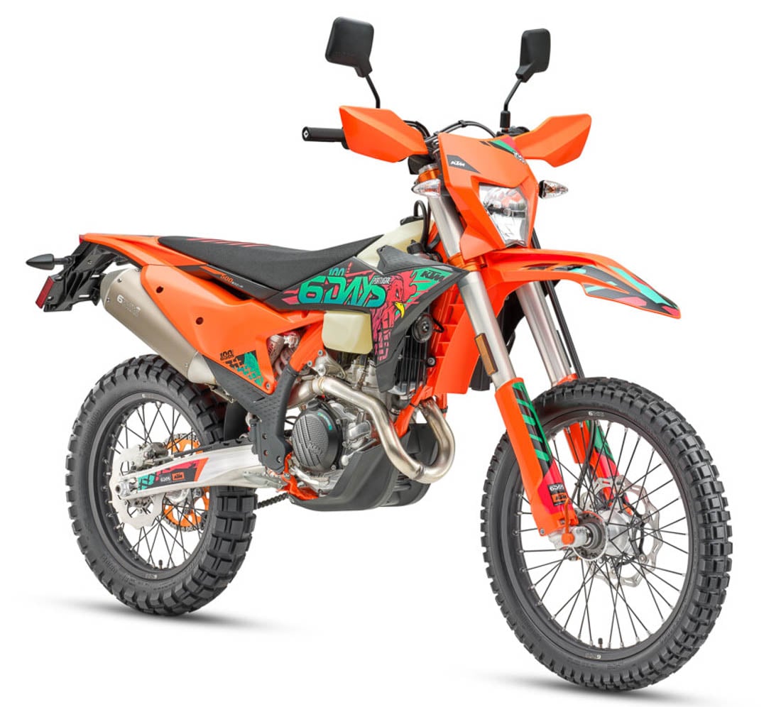 2027 KTM 500 EXC-F 6Days three-quarter front studio — orange bodywork, 6Days graphics, dual-sport lighting