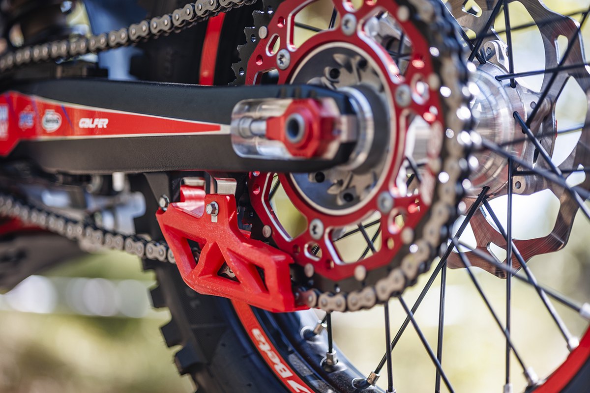 2027 Beta RR Race rear wheel with red chain guide, sprocket and axle adjuster