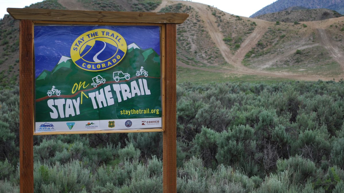 Stay the Trail sign above OHV routes at Wolford Mountain Recreation Area in Grand County, Colorado