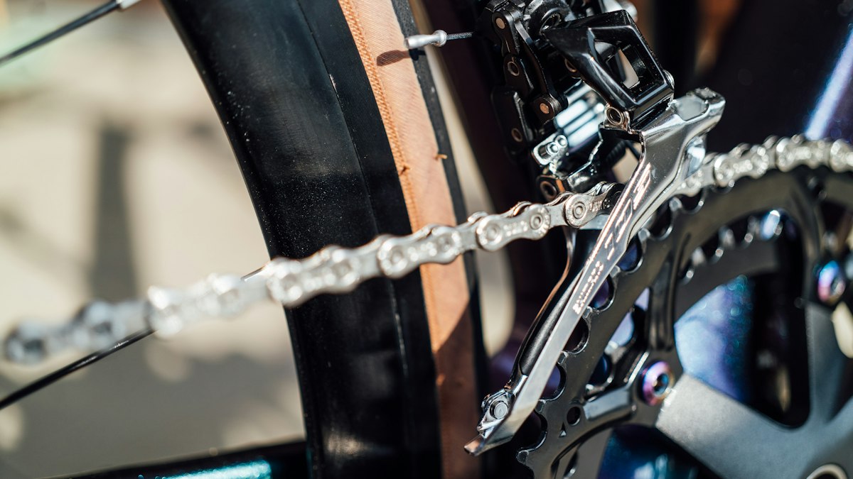 Close-up of a bicycle/motorcycle-style drive chain and gear — topic object for chain service