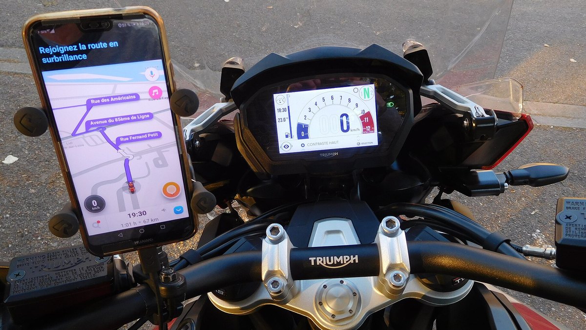 Smartphone in a handlebar mount running navigation on a 2018 Triumph Tiger 1200 XRt cockpit