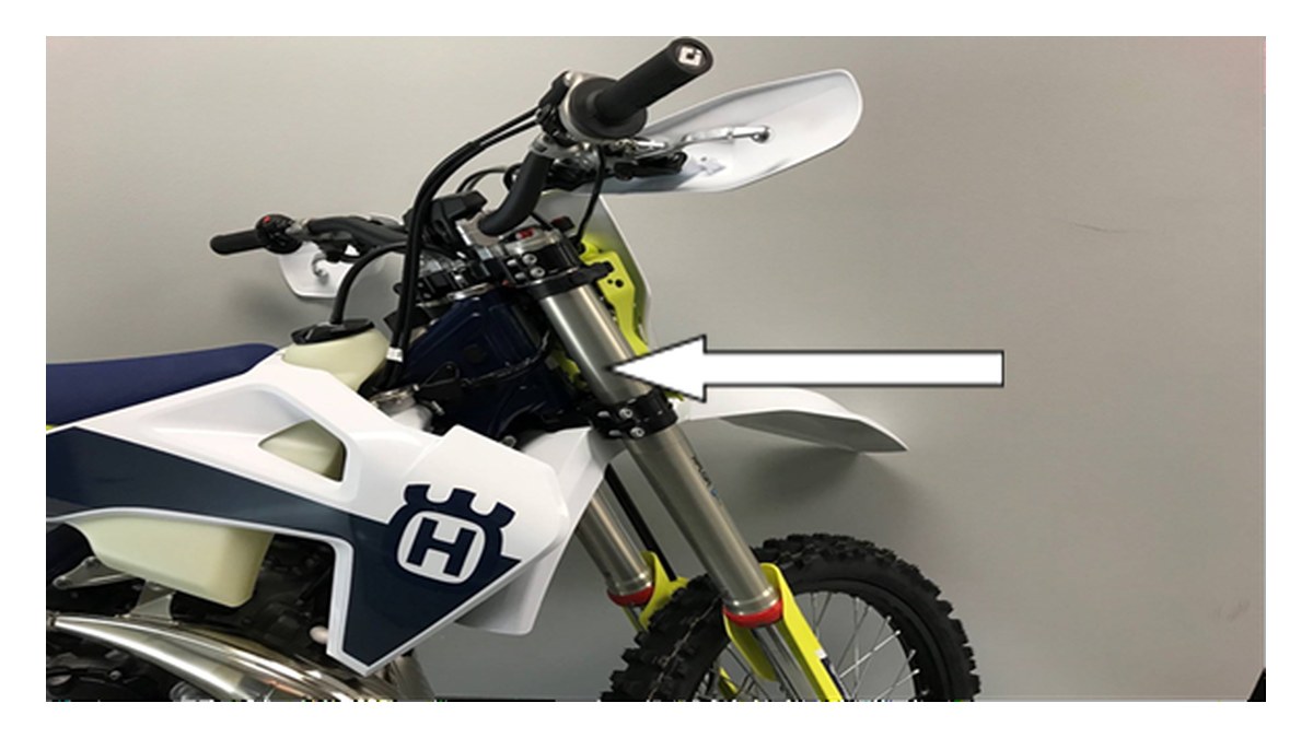 Arrow marking the VIN on the right side of a Husqvarna steering head, per CPSC recall 26-710