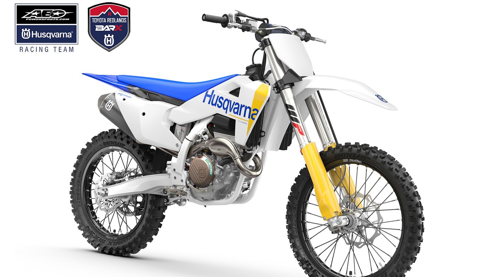 A white Husqvarna FC 250 motocross bike with a blue seat, yellow fork guards and a blue Husqvarna logo on the side panel, shown in a three-quarter studio view on a white background, with the AEO Powersports Husqvarna Racing Team and Toyota Redlands BarX Husqvarna logos in the top left corner