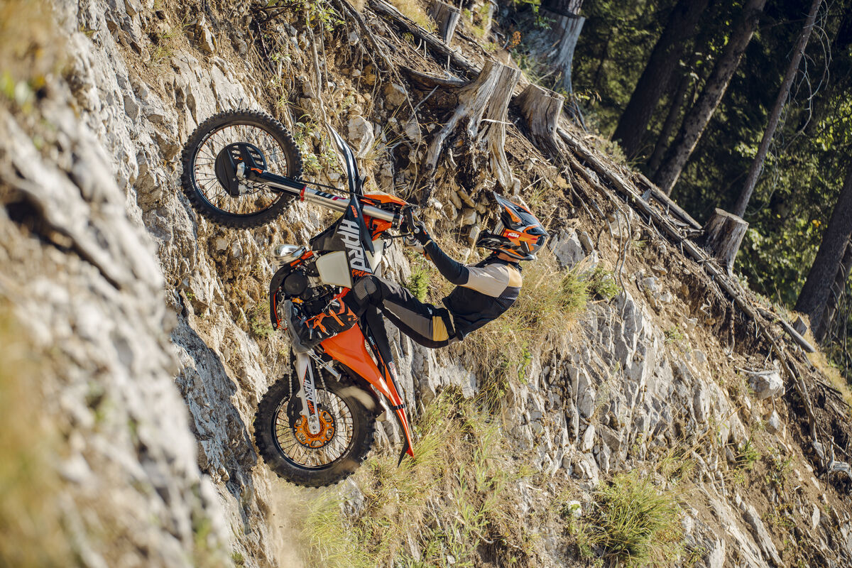 2027 KTM 300 EXC HARDENDURO on steep rocky climb — HARD graphics readable on side panel