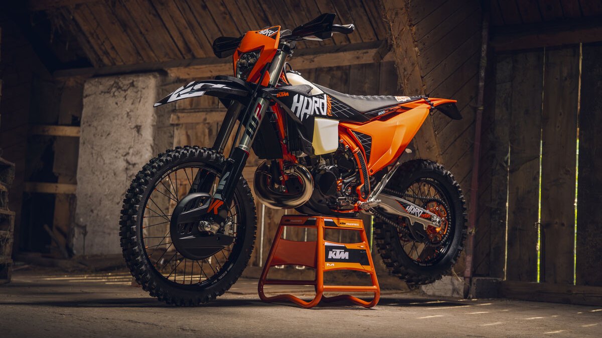2027 KTM 300 EXC HARDENDURO on a stand in a barn, WP fork and rear shock in view